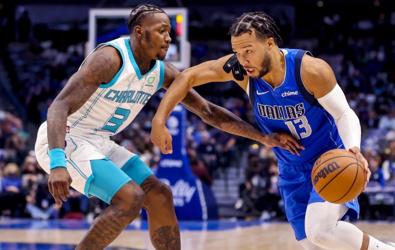 Dec 13, 2021; Dallas, Texas, USA;  Dallas Mavericks guard Jalen Brunson (13) drives to the basket as Charlotte Hornets guard Terry Rozier (3) defends during the first quarter at American Airlines Center. Mandatory Credit: Kevin Jairaj-USA TODAY Sports