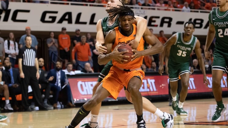 Dec 13, 2021; Stillwater, Oklahoma, USA; Oklahoma State Cowboys forward Tyreek Smith (23) fouled by Cleveland State Vikings guard Broc Finstuen (23) during the first half at Gallagher-Iba Arena. Mandatory Credit: Rob Ferguson-USA TODAY Sports