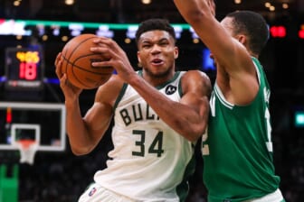 Dec 13, 2021; Boston, Massachusetts, USA; Milwaukee Bucks forward Giannis Antetokounmpo (34) drives to the basket defended by Boston Celtics forward Grant Williams (12) during the second half at TD Garden. Mandatory Credit: Paul Rutherford-USA TODAY Sports