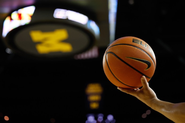 Dec 11, 2021; Ann Arbor, Michigan, USA;  Referee hold a ball up during the game between the Michigan Wolverines and the Minnesota Golden Gophers at Crisler Center. Mandatory Credit: Rick Osentoski-USA TODAY Sports