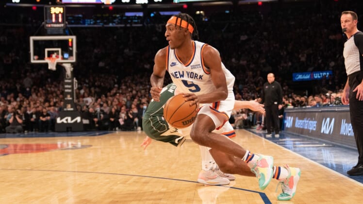 Dec 12, 2021; New York, New York, USA; New York Knicks shooting guard Immanuel Quickley (5) dribbles the ball toward the basket during the first half against the Milwaukee Bucks at Madison Square Garden. Mandatory Credit: Gregory Fisher-USA TODAY Sports