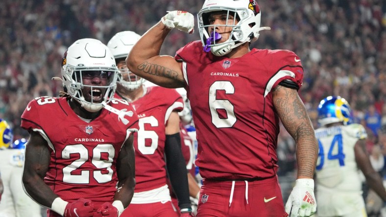 Dec 13, 2021; Glendale, Arizona, USA; Arizona Cardinals running back James Conner (6) celebrates after scoring a rushing touchdown against the Los Angeles Rams during the fourth quarter at State Farm Stadium. Mandatory Credit: Michael Chow-Arizona Republic

Nfl Los Angeles Rams At Arizona Cardinals