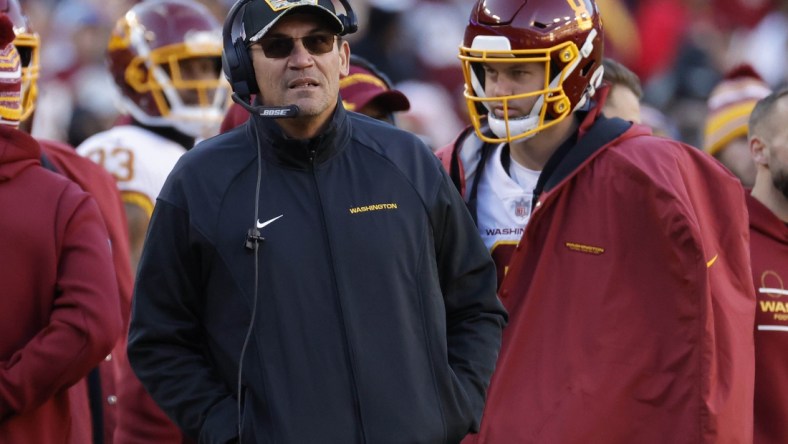 Dec 12, 2021; Landover, Maryland, USA;  Washington Football Team head coach Ron Rivera (M) looks on from the sidelines against the Dallas Cowboys at FedExField. Mandatory Credit: Geoff Burke-USA TODAY Sports