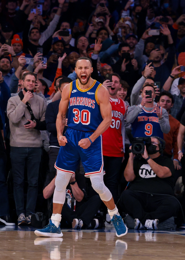 Dec 14, 2021; New York, New York, USA; Golden State Warriors guard Stephen Curry (30) reacts after a three point basket breaking the career record for total three pointers made  during the during the first quarter against the New York Knicks at Madison Square Garden. Mandatory Credit: Vincent Carchietta-USA TODAY Sports