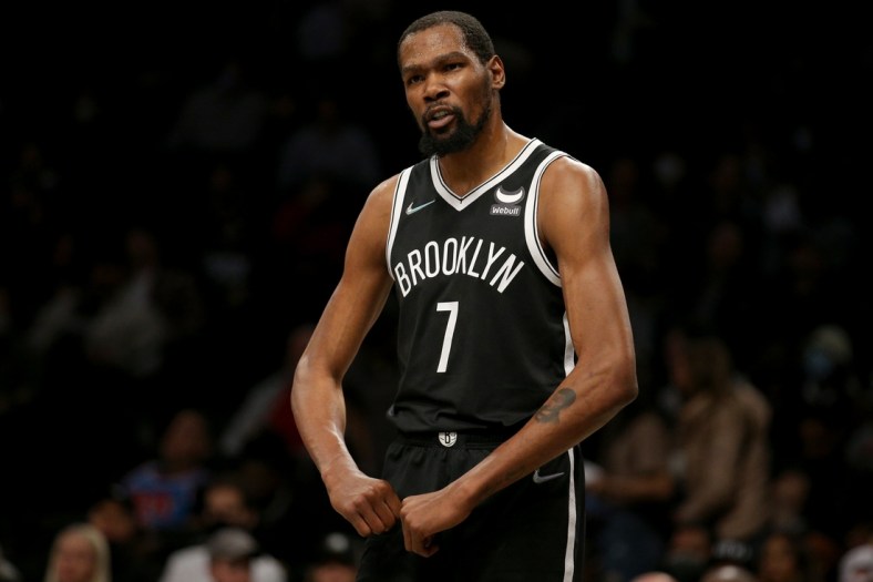 Dec 14, 2021; Brooklyn, New York, USA; Brooklyn Nets forward Kevin Durant (7) reacts during the first quarter against the Toronto Raptors at Barclays Center. Mandatory Credit: Brad Penner-USA TODAY Sports