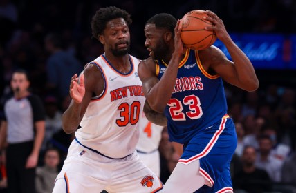 Dec 14, 2021; New York, New York, USA; Golden State Warriors forward Draymond Green (23) shield the ball from New York Knicks forward Julius Randle (30) during the second half at Madison Square Garden. Mandatory Credit: Vincent Carchietta-USA TODAY Sports