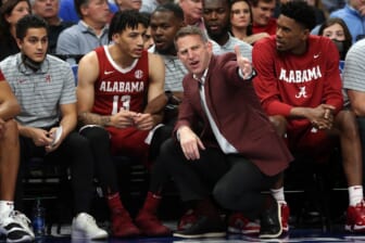 Dec 14, 2021; Memphis, Tennessee, USA; Alabama Crimson Tide head coach Nate Oats talks with Alabama Crimson Tide guard Jahvon Quinerly (13) on the bench during the first half against the Memphis Tigers at FedExForum. Mandatory Credit: Petre Thomas-USA TODAY Sports