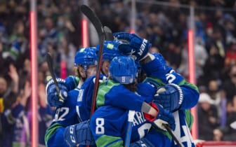 Dec 14, 2021; Vancouver, British Columbia, CAN; Vancouver Canucks forward Elias Pettersson (40) and forward Conor Garland (8) celebrate Pettersson s goal against the Columbus Blue Jackets in the third period at Rogers Arena. Vancouver Won 4-3. Mandatory Credit: Bob Frid-USA TODAY Sports
