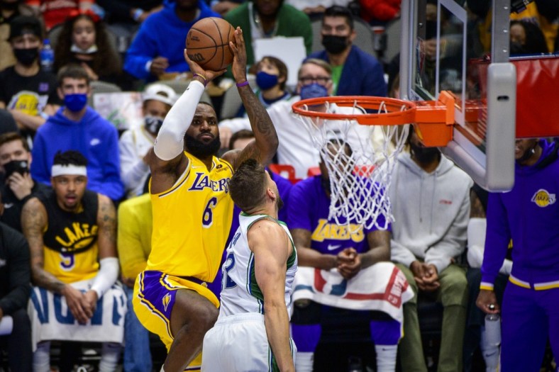 Dec 15, 2021; Dallas, Texas, USA; Los Angeles Lakers forward LeBron James (6) shoots over Dallas Mavericks forward Maxi Kleber (42) during the first half at the American Airlines Center. Mandatory Credit: Jerome Miron-USA TODAY Sports