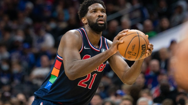 Dec 15, 2021; Philadelphia, Pennsylvania, USA; Philadelphia 76ers center Joel Embiid (21) shoots the ball against the Miami Heat during the third quarter at Wells Fargo Center. Mandatory Credit: Bill Streicher-USA TODAY Sports