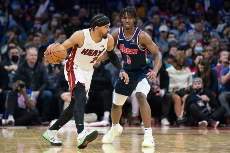 Dec 15, 2021; Philadelphia, Pennsylvania, USA; Miami Heat guard Gabe Vincent (2) dribbles the ball against Philadelphia 76ers guard Tyrese Maxey (0) during the fourth quarter at Wells Fargo Center. Mandatory Credit: Bill Streicher-USA TODAY Sports