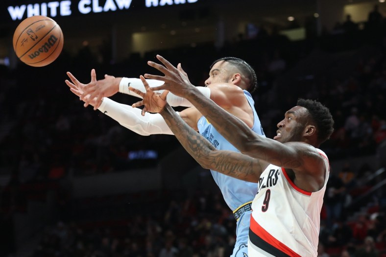 Dec 15, 2021; Portland, Oregon, USA;  Memphis Grizzlies forward Dillon Brooks (24) and Portland Trail Blazers forward Nassir Little (9) fight for the ball in the first half at Moda Center. Mandatory Credit: Jaime Valdez-USA TODAY Sports