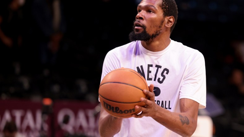 Dec 16, 2021; Brooklyn, New York, USA; Brooklyn Nets forward Kevin Durant (7) warms up before the game against the Philadelphia 76ers at Barclays Center. Mandatory Credit: Vincent Carchietta-USA TODAY Sports