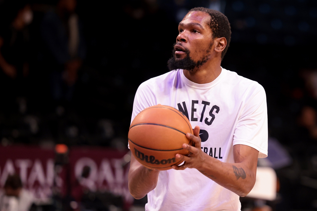 Dec 16, 2021; Brooklyn, New York, USA; Brooklyn Nets forward Kevin Durant (7) warms up before the game against the Philadelphia 76ers at Barclays Center. Mandatory Credit: Vincent Carchietta-USA TODAY Sports