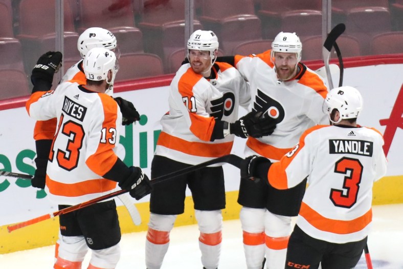 Dec 16, 2021; Montreal, Quebec, CAN; Philadelphia Flyers center Max Willman (71) celebrates his goal against Montreal Canadiens with teammates during the second period at Bell Centre. Mandatory Credit: Jean-Yves Ahern-USA TODAY Sports