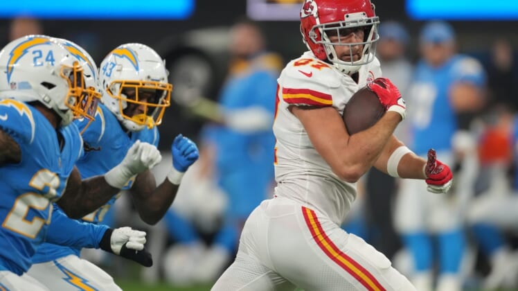 Dec 16, 2021; Inglewood, California, USA; Kansas City Chiefs tight end Travis Kelce (87) runs with the ball against the Los Angeles Chargers in the second half at SoFi Stadium. Mandatory Credit: Kirby Lee-USA TODAY Sports