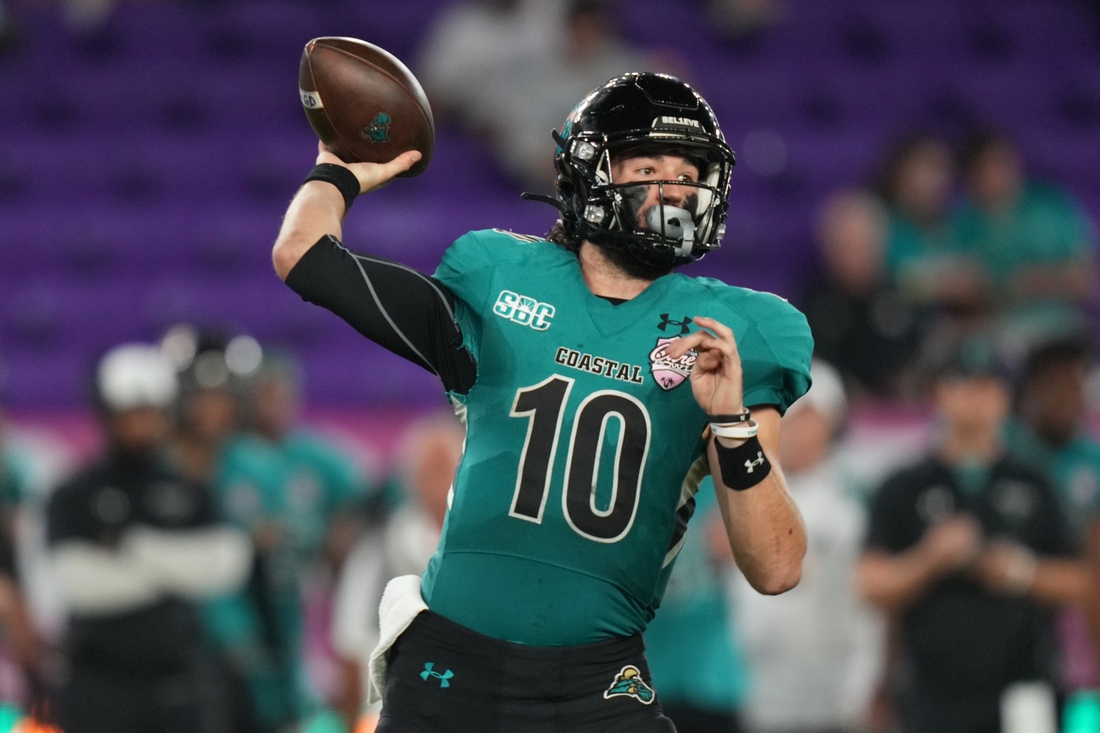 Dec 17, 2021; Orlando, Florida, USA; Coastal Carolina Chanticleers quarterback Grayson McCall (10) attempts a pass against the Northern Illinois Huskies during the second half of the 2021 Cure Bowl game at Exploria Stadium. Mandatory Credit: Jasen Vinlove-USA TODAY Sports