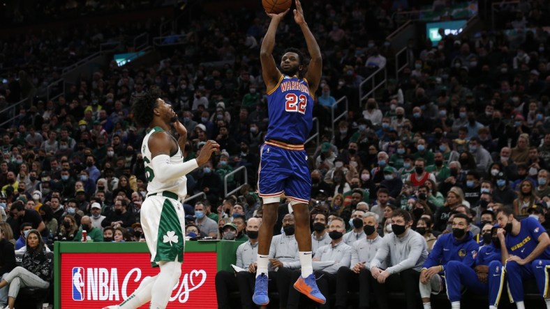 Dec 17, 2021; Boston, Massachusetts, USA; Golden State Warriors forward Andrew Wiggins (22) shoots past Boston Celtics guard Marcus Smart (36) during the first quarter at TD Garden. Mandatory Credit: Winslow Townson-USA TODAY Sports