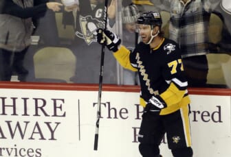 Dec 17, 2021; Pittsburgh, Pennsylvania, USA;  Pittsburgh Penguins center Jeff Carter (77) reacts after scoring the game winning goal against the Buffalo Sabres in overtime at PPG Paints Arena. The Penguins won 3-2 in overtime. Mandatory Credit: Charles LeClaire-USA TODAY Sports