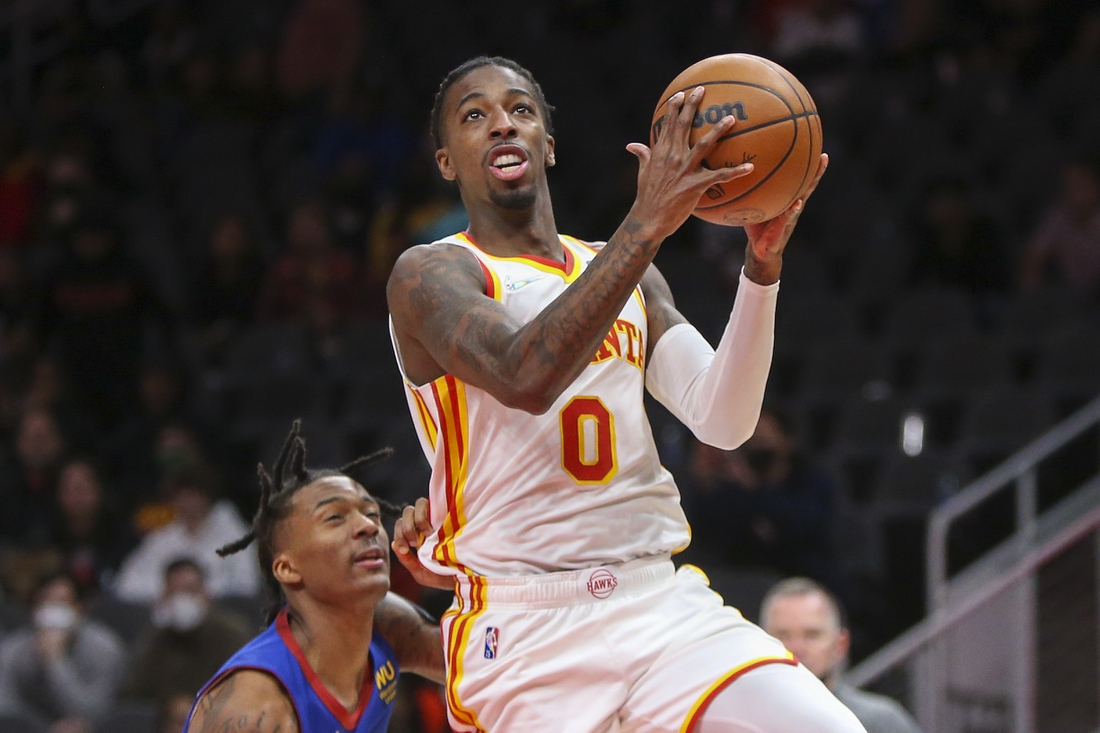 Dec 17, 2021; Atlanta, Georgia, USA; Atlanta Hawks guard Delon Wright (0) shoots against the Denver Nuggets in the second half at State Farm Arena. Mandatory Credit: Brett Davis-USA TODAY Sports