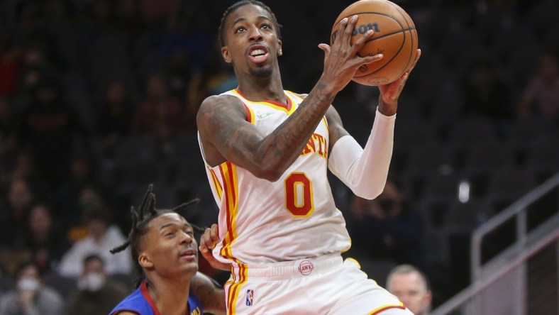 Dec 17, 2021; Atlanta, Georgia, USA; Atlanta Hawks guard Delon Wright (0) shoots against the Denver Nuggets in the second half at State Farm Arena. Mandatory Credit: Brett Davis-USA TODAY Sports