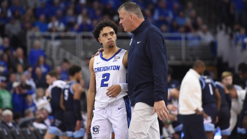 Dec 17, 2021; Omaha, Nebraska, USA;  Creighton Bluejays head coach Greg McDermott talks with guard Ryan Nembhard (2) during a break in the game against the Villanova Wildcats in the second half at CHI Health Center Omaha. Mandatory Credit: Steven Branscombe-USA TODAY Sports