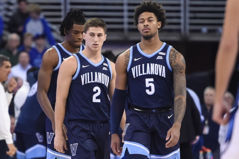 Dec 17, 2021; Omaha, Nebraska, USA;  Villanova Wildcats guard Collin Gillespie (2) and guard Justin Moore (5) take the court against the Creighton Bluejays in the first half at CHI Health Center Omaha. Mandatory Credit: Steven Branscombe-USA TODAY Sports
