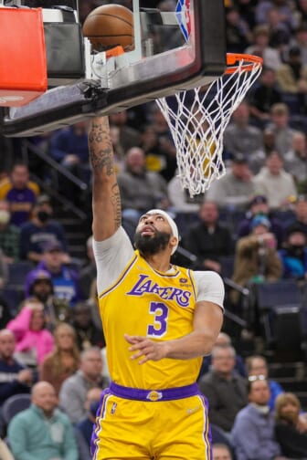 Dec 17, 2021; Minneapolis, Minnesota, USA; Los Angeles Lakers forward Anthony Davis (3) shoots against the Minnesota Timberwolves in the first quarter at Target Center. Mandatory Credit: Brad Rempel-USA TODAY Sports