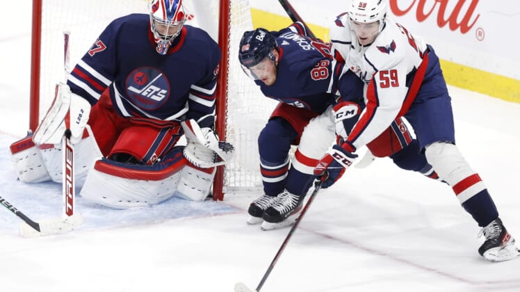 NHL roundup: Caps down Jets, spoil Dave Lowry's coaching debut