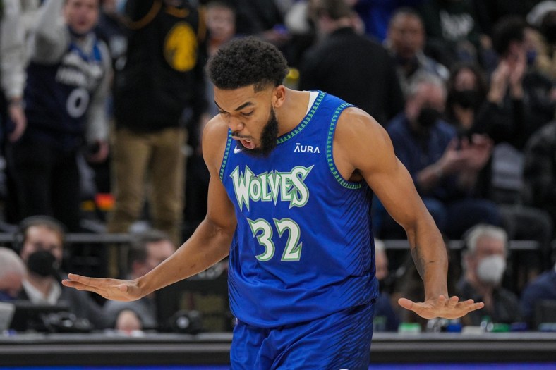 Dec 17, 2021; Minneapolis, Minnesota, USA; Minnesota Timberwolves center Karl-Anthony Towns (32) celebrates his basket against the Los Angeles Lakers in the second quarter at Target Center. Mandatory Credit: Brad Rempel-USA TODAY Sports