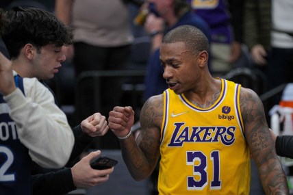Dec 17, 2021; Minneapolis, Minnesota, USA; Los Angeles Lakers guard Isaiah Thomas (31) fist bumps a fan after the game against the Minnesota Timberwolves at Target Center. Mandatory Credit: Brad Rempel-USA TODAY Sports