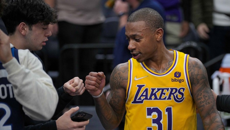 Dec 17, 2021; Minneapolis, Minnesota, USA; Los Angeles Lakers guard Isaiah Thomas (31) fist bumps a fan after the game against the Minnesota Timberwolves at Target Center. Mandatory Credit: Brad Rempel-USA TODAY Sports