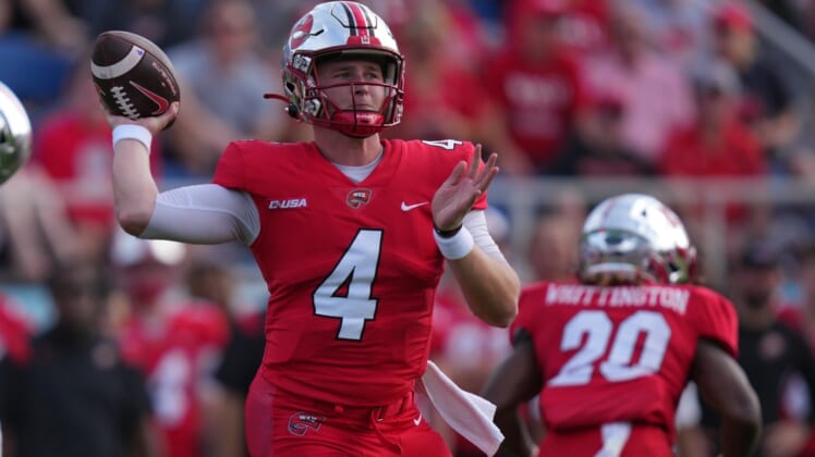 Dec 18, 2021; Boca Raton, Florida, USA; Western Kentucky Hilltoppers quarterback Bailey Zappe (4) attempts a pass against the Appalachian State Mountaineers during the first half in the 2021 Boca Raton Bowl at FAU Stadium. Mandatory Credit: Jasen Vinlove-USA TODAY Sports