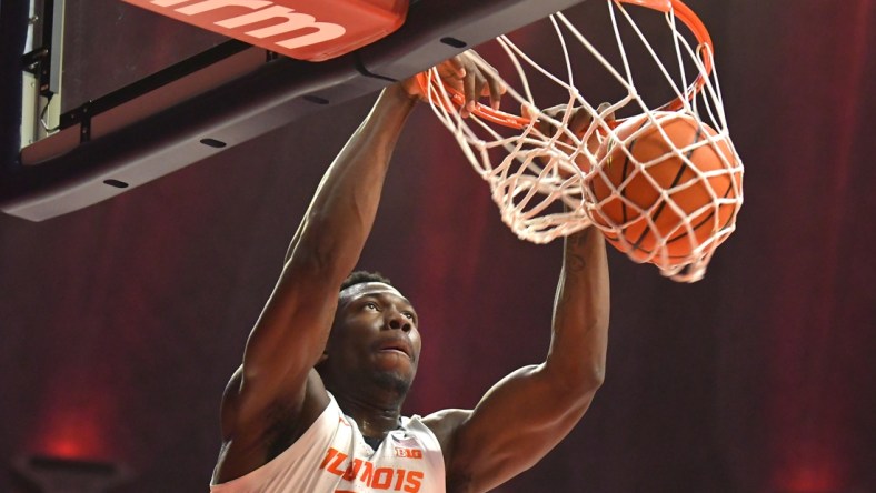 Dec 18, 2021; Champaign, Illinois, USA;  Illinois Fighting Illini center Kofi Cockburn (21) dunks the ball during the first half against the Saint Francis Red Flash at State Farm Center. Mandatory Credit: Ron Johnson-USA TODAY Sports