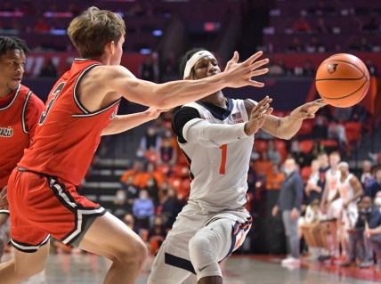 Dec 18, 2021; Champaign, Illinois, USA;  Illinois Fighting Illini guard Trent Frazier (1) passes the ball past Saint Francis Red Flash guard Luke Ruggery (3) during the first half at State Farm Center. Mandatory Credit: Ron Johnson-USA TODAY Sports
