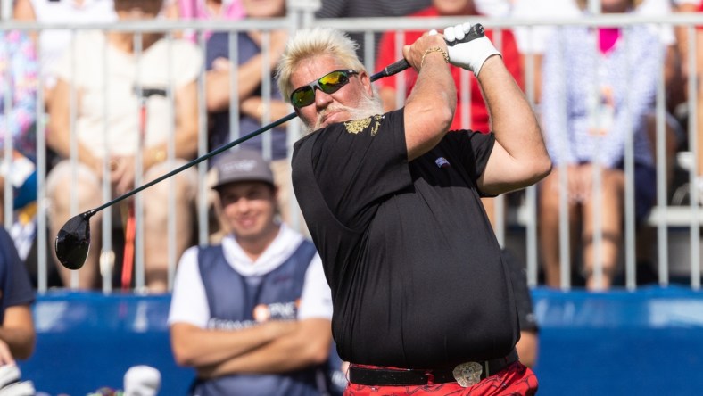 Dec 18, 2021; Orlando, Florida, USA; John Daly plays his shot off the first tee during the first round of the PNC Championship golf tournament at Grande Lakes Orlando Course. Mandatory Credit: Jeremy Reper-USA TODAY Sports