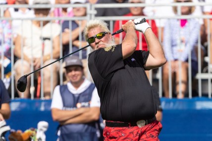 Dec 18, 2021; Orlando, Florida, USA; John Daly plays his shot off the first tee during the first round of the PNC Championship golf tournament at Grande Lakes Orlando Course. Mandatory Credit: Jeremy Reper-USA TODAY Sports