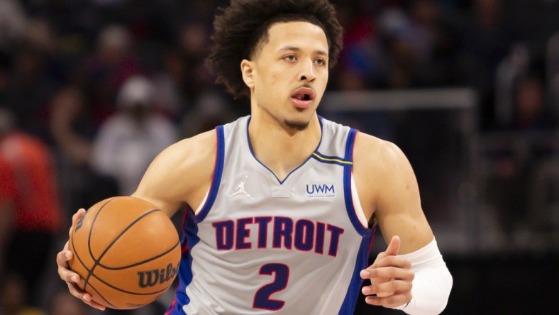 Dec 18, 2021; Detroit, Michigan, USA; Detroit Pistons guard Cade Cunningham (2) dribbles the ball during the fourth quarter against the Houston Rockets at Little Caesars Arena. Mandatory Credit: Raj Mehta-USA TODAY Sports