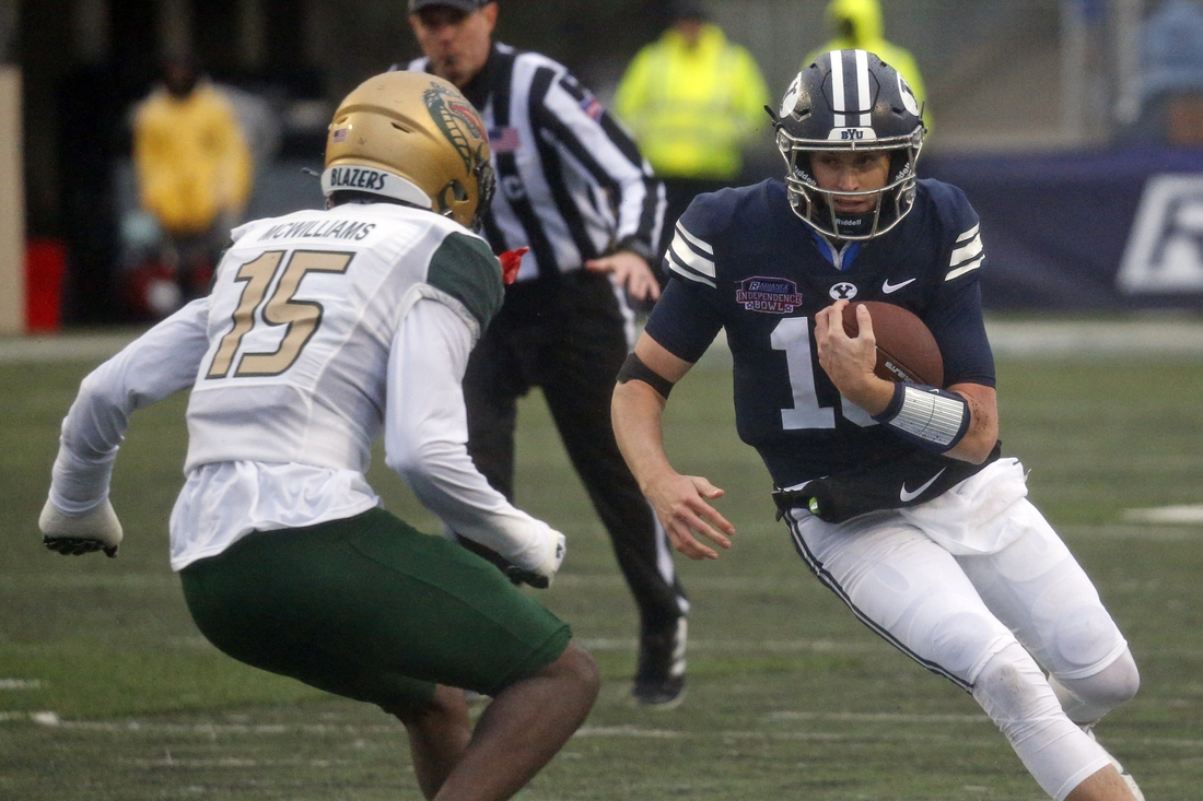 Dec 18, 2021; Shreveport, LA, USA; BYU Cougars quarterback Baylor Romney (16) runs the ball during the second quarter against the UAB Blazers during the 2021 Independence Bowl at Independence Stadium. Mandatory Credit: Petre Thomas-USA TODAY Sports