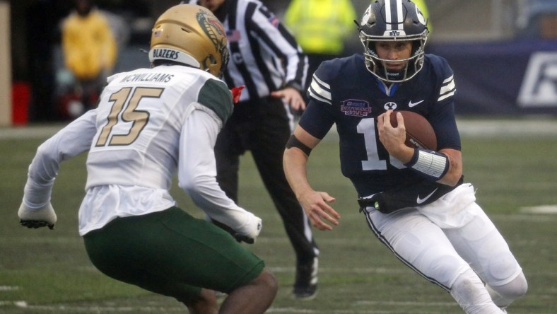 Dec 18, 2021; Shreveport, LA, USA; BYU Cougars quarterback Baylor Romney (16) runs the ball during the second quarter against the UAB Blazers during the 2021 Independence Bowl at Independence Stadium. Mandatory Credit: Petre Thomas-USA TODAY Sports