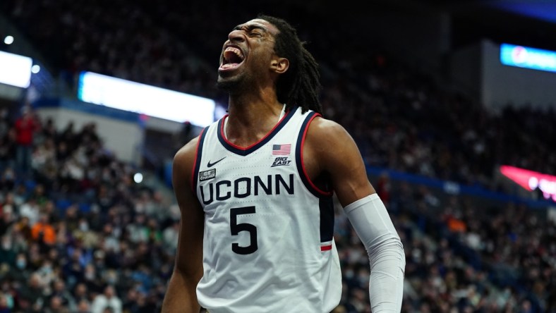 Dec 18, 2021; Hartford, Connecticut, USA; Connecticut Huskies forward Isaiah Whaley (5) reacts after a basket and foul as they take on the Providence Friars in the first half at XL Center. Mandatory Credit: David Butler II-USA TODAY Sports