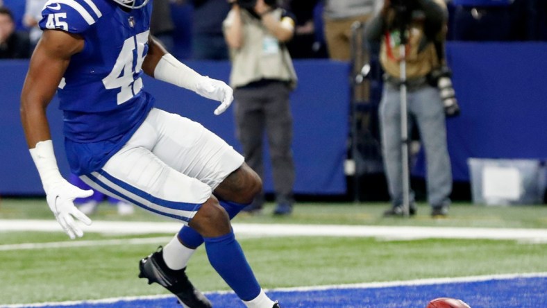 Indianapolis Colts linebacker E.J. Speed (45) rushes to dive on a blocked punt to score a touchdown Saturday, Dec. 18, 2021, during a game against the New England Patriots at Lucas Oil Stadium in Indianapolis.