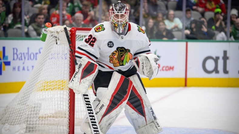 Dec 18, 2021; Dallas, Texas, USA; Chicago Blackhawks goaltender Kevin Lankinen (32) faces the Dallas Stars attack during the second period at the American Airlines Center. Mandatory Credit: Jerome Miron-USA TODAY Sports