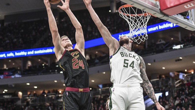 Dec 18, 2021; Milwaukee, Wisconsin, USA;  Cleveland Cavaliers forward Lauri Markkanen (24) shoots the ball against Milwaukee Bucks forward Sandro Mamukelashvili (54) in the second quarter at Fiserv Forum. Mandatory Credit: Benny Sieu-USA TODAY Sports