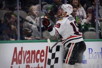 Dec 18, 2021; Dallas, Texas, USA; Chicago Blackhawks center Jonathan Toews (19) crashes into the glass during the third period against the Dallas Stars at the American Airlines Center. Mandatory Credit: Jerome Miron-USA TODAY Sports