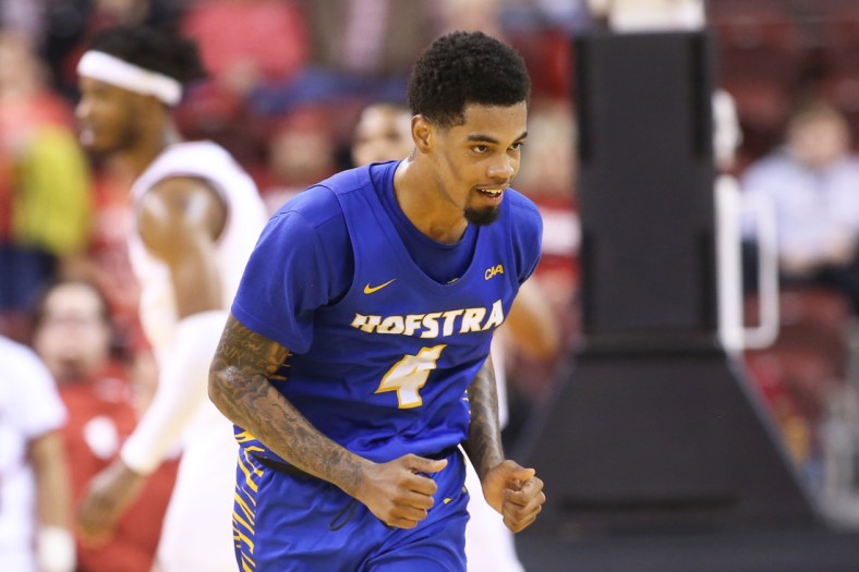 Dec 18, 2021; North Little Rock, Arkansas, USA; Hofstra Pride guard Aaron Estrada (4) celebrates after scoring in the second half against the Arkansas Razorbacks at Simmons Bank Arena. Hofstra won 89-81. Mandatory Credit: Nelson Chenault-USA TODAY Sports
