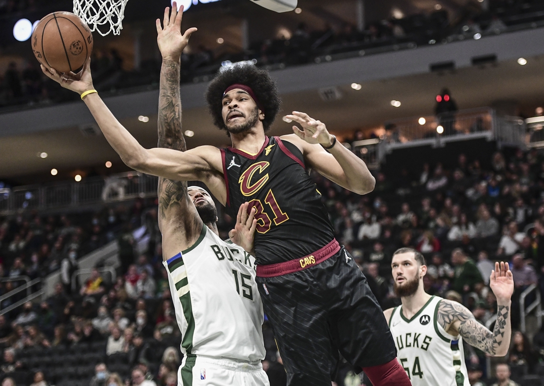 Dec 18, 2021; Milwaukee, Wisconsin, USA;  Cleveland Cavaliers center Jarrett Allen (31) takes a shot against Milwaukee Bucks center DeMarcus Cousins (15) in the fourth quarter at Fiserv Forum. Mandatory Credit: Benny Sieu-USA TODAY Sports