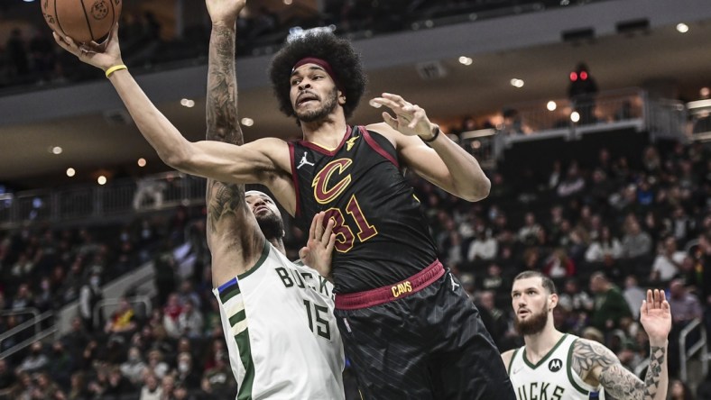 Dec 18, 2021; Milwaukee, Wisconsin, USA;  Cleveland Cavaliers center Jarrett Allen (31) takes a shot against Milwaukee Bucks center DeMarcus Cousins (15) in the fourth quarter at Fiserv Forum. Mandatory Credit: Benny Sieu-USA TODAY Sports