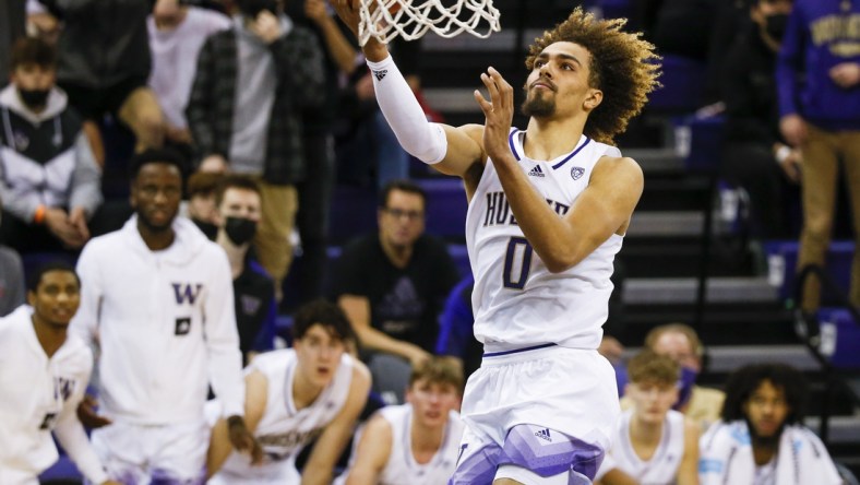 Dec 18, 2021; Seattle, Washington, USA; Washington Huskies forward Emmitt Matthews Jr. (0) shoots a layup against the Seattle Redhawks during the second half at Alaska Airlines Arena at Hec Edmundson Pavilion. Mandatory Credit: Joe Nicholson-USA TODAY Sports