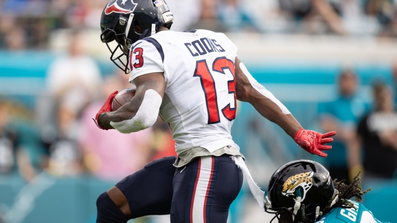 Dec 19, 2021; Jacksonville, Florida, USA; Houston Texans wide receiver Brandin Cooks (13) runs with the ball for a touchdown during the first half against the Jacksonville Jaguars at TIAA Bank Field. Mandatory Credit: Matt Pendleton-USA TODAY Sports